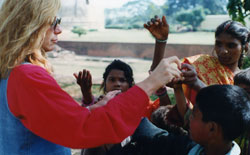 Rev. Dr. Nancy feeding hungry children of India, from her healing quotes collection, '90s